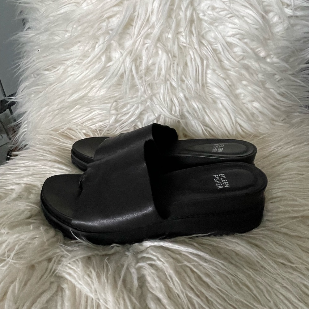 Eileen Fisher black leather slip on sandals.